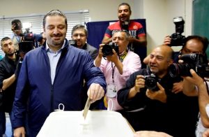 Lebanese former prime minister Saad Hariri (C), whose Future Movement usually dominates elections in the capital, casts his vote for the municipal elections on May 8, 2016 at a polling station, in the capital Beirut.   Lebanese headed to the polls for first time in six years on Sunday for municipal elections including in Beirut, where a new grassroots campaign is taking on entrenched parties. Polling stations opened at 0400 GMT in Beirut and in two provinces of the Bekaa region in the first stage of a vote to last until May 29 in five other provinces.  / AFP PHOTO / ANWAR AMRO